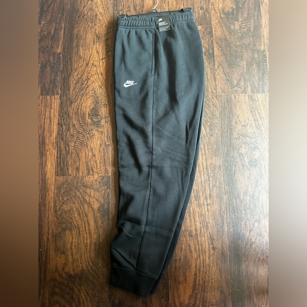 Black Nike sweatpants.
